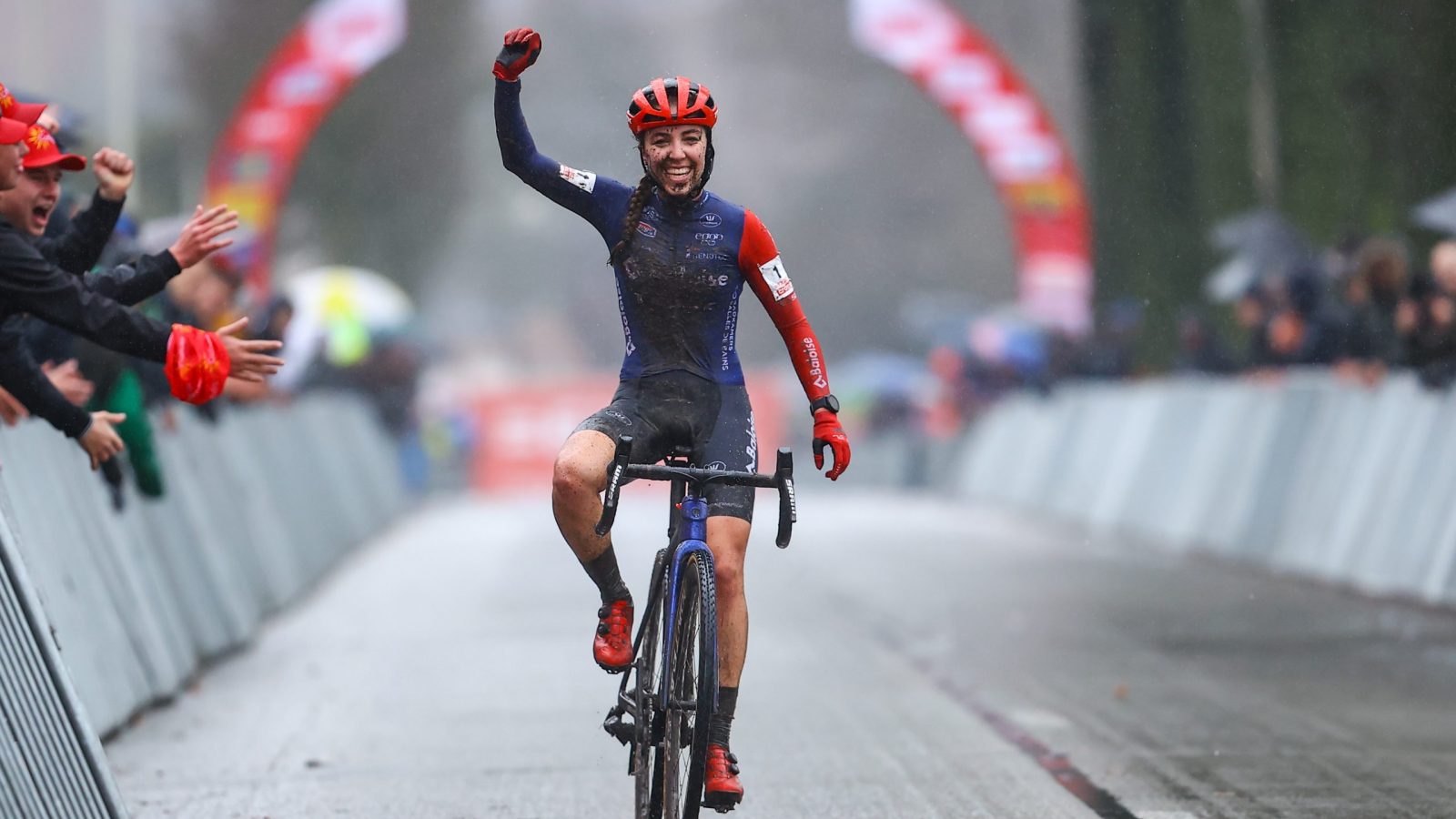 Dutch Shirin van Anrooij celebrates as she crosses the finish line to win the women's elite race of the cyclocross cycling event, race 6/8 in the 'Exact Cross' competition, Friday 30 December 2022 in Loenhout. BELGA PHOTO DAVID PINTENS