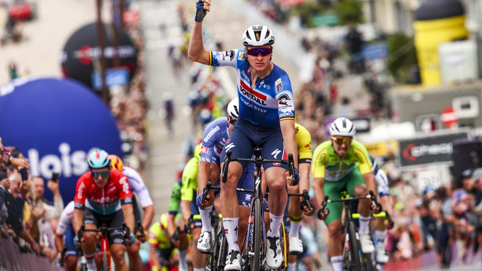 Belgian Tim Merlier of Soudal Quick-Step celebrates as he crosses the finish line at the second stage of the Baloise Belgium Tour cycling race, 184,2 km from Merelbeke to Knokke-Heist, on Thursday 13 June 2024. BELGA PHOTO DAVID PINTENS