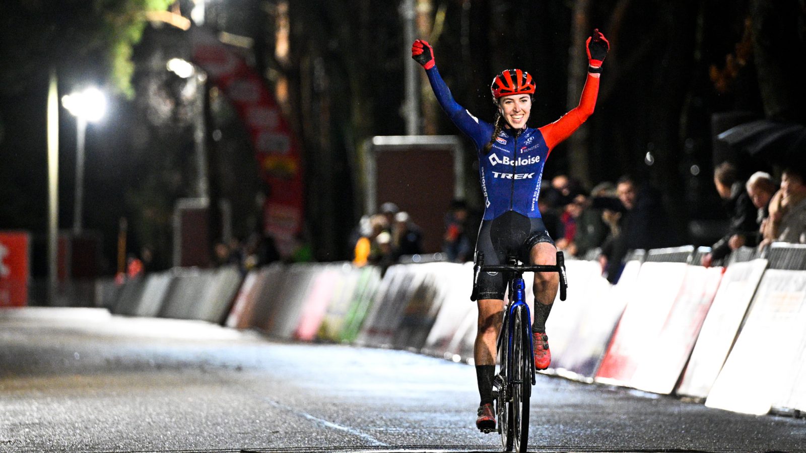 Dutch Shirin van Anrooij celebrates as she crosses the finish line to win the women's elite race of the 'Zilvermeer Mol' cyclocross cycling event, race 5/8 in the 'Exact Cross' competition, Friday 23 December 2022 in Mol.
BELGA PHOTO JASPER JACOBS